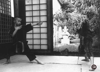 Second photo of young Brian Denis practicing ninjutsu