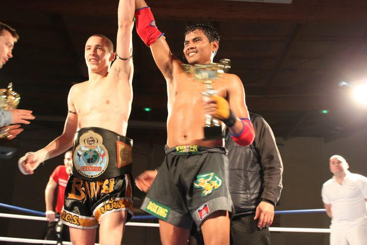Brian Denis congratulated by his opponent